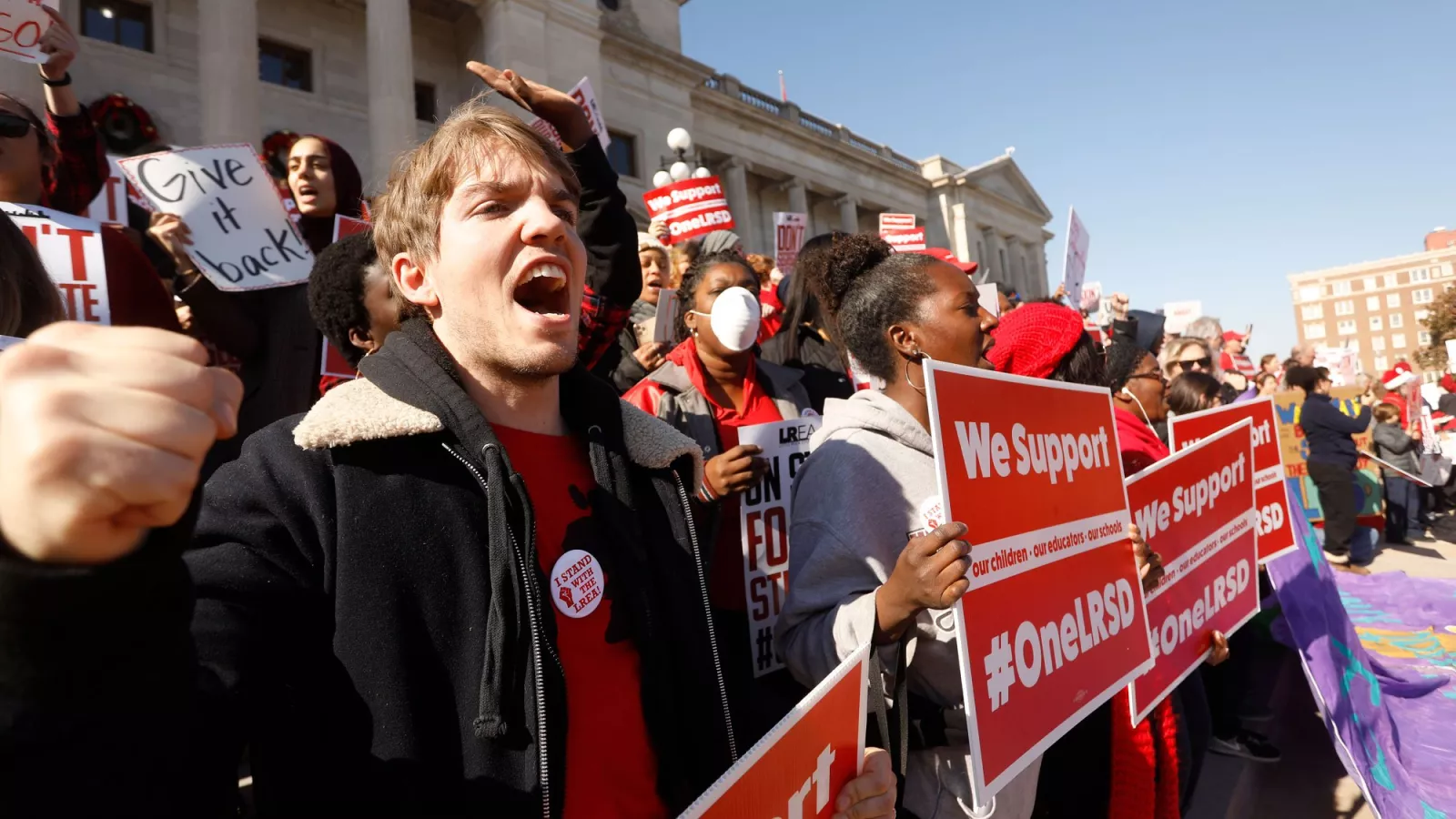 a group of educators protesting