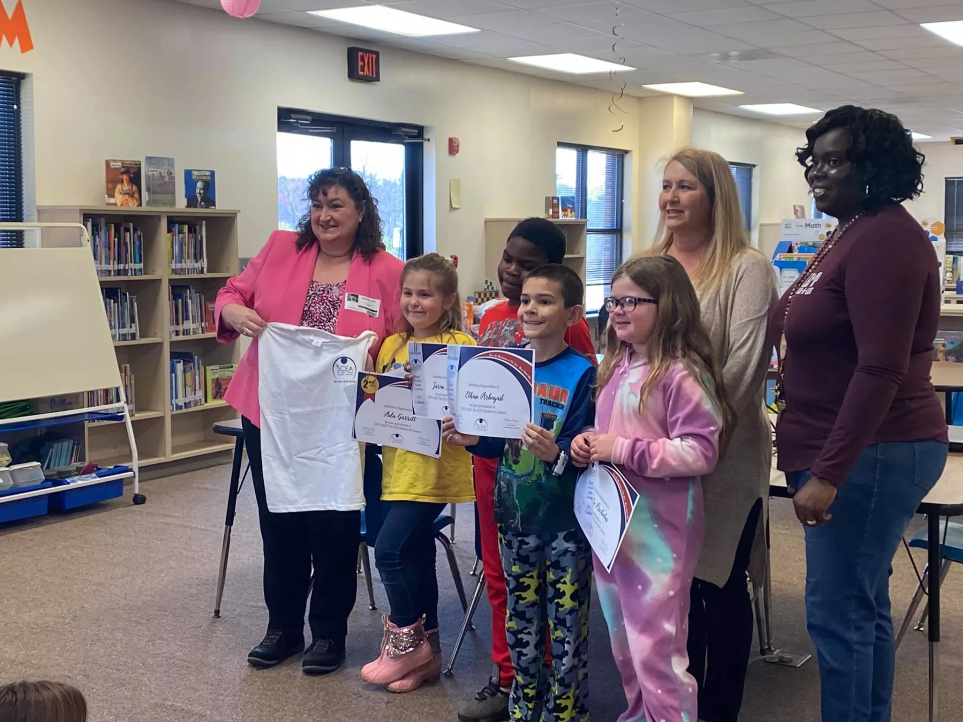 President Sherry East poses with students during Read Across America.