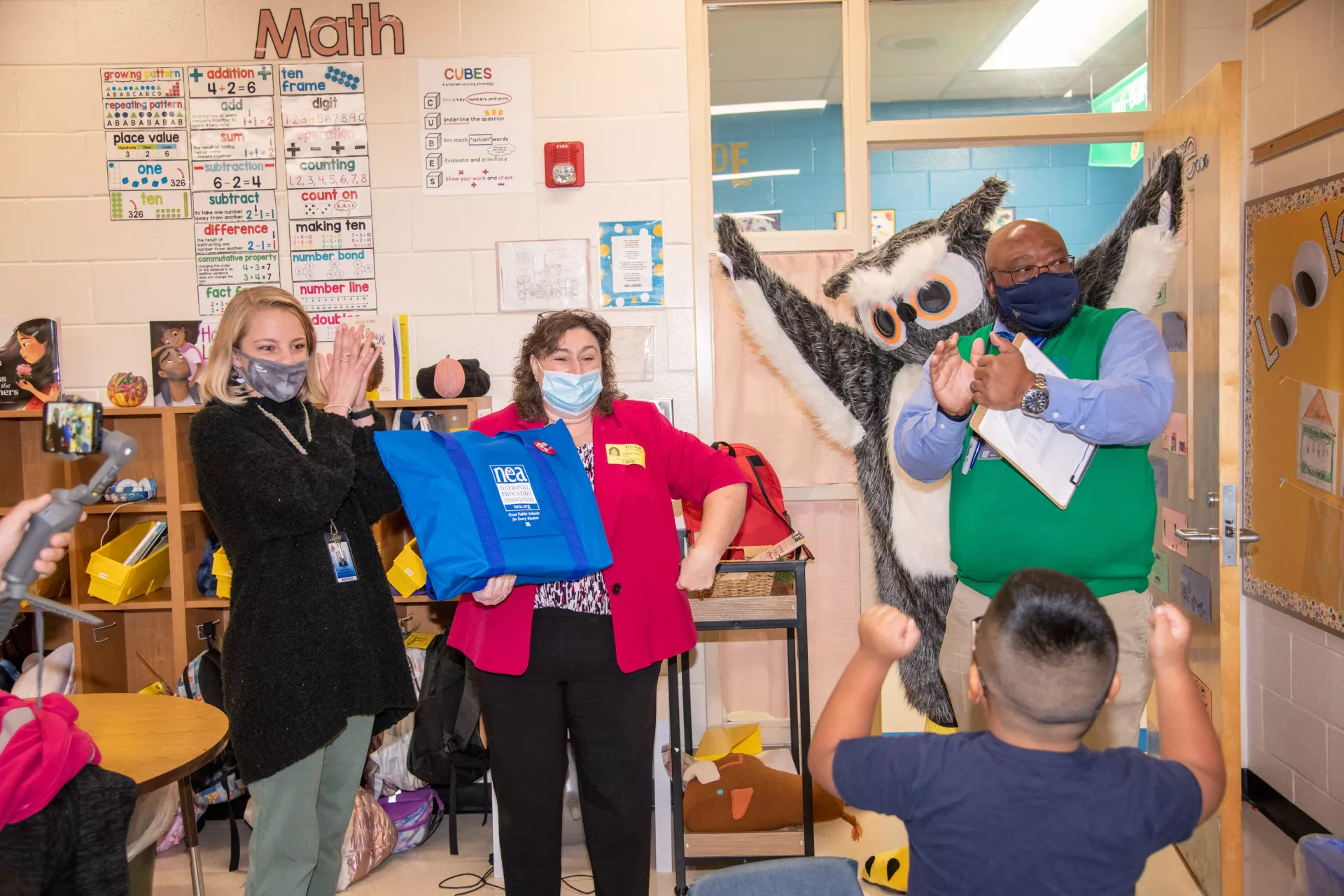 Teacher, Cat Holub-Ward with her students, The SCEA President Sherry East, and Greenville County Education Association President Terrell Brown at Monaview Elementary School in Greenville, SC.