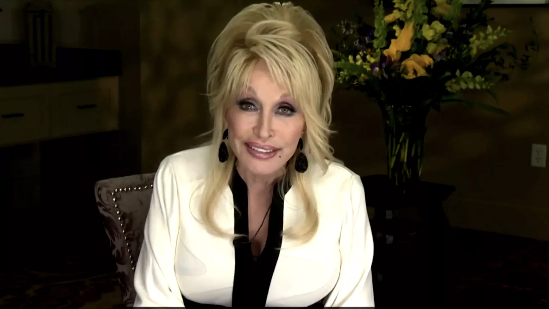 screenshot of Dolly Parton speaking to RA delegates via video