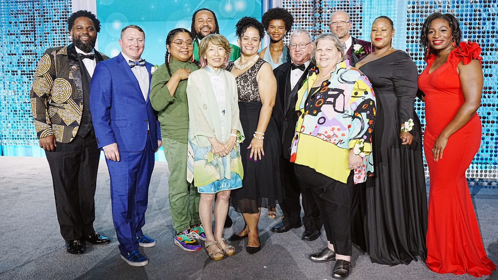 the 2023 winners of the NEA Human and Civil Rights Awards stand for photo with emcee Marley Dias
