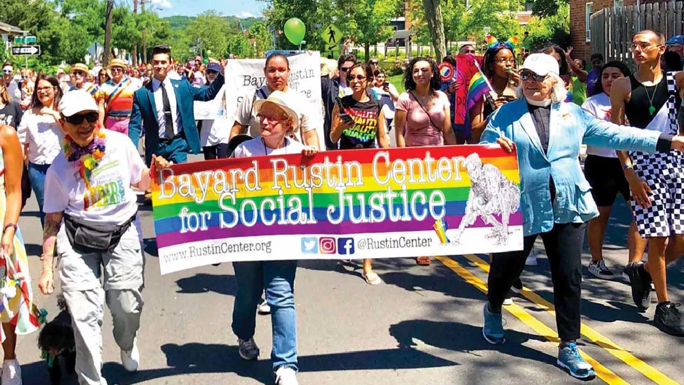 Carol Watchler (left) leads the Pride Parade in Princeton, N.J.
