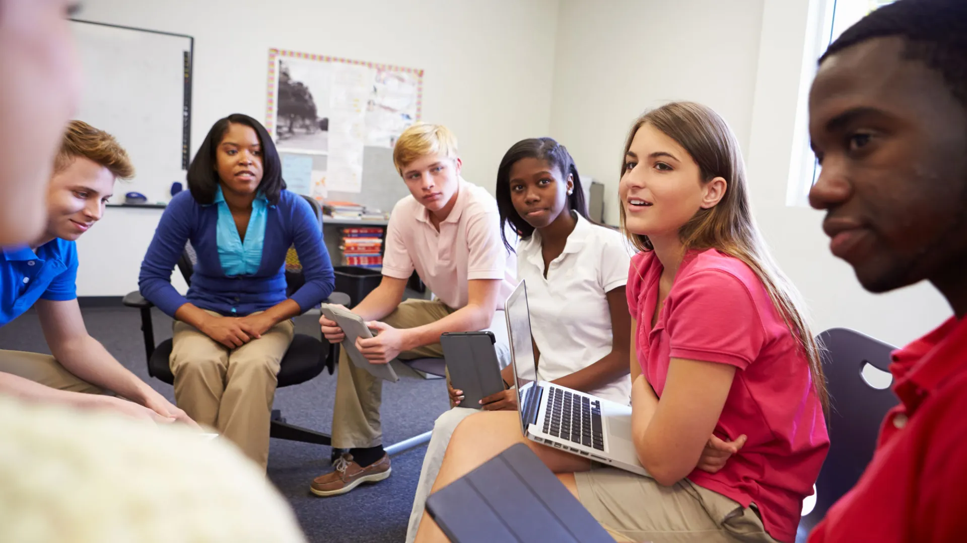 high school students talk in a circle