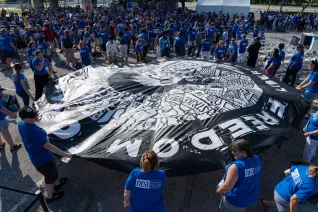 Attendees at the 2023 Freedom to Learn rally in Orlando raise parachute artwork
