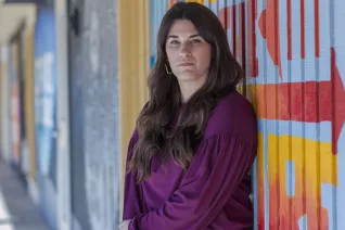 Educator Erin Castillo outside her school building