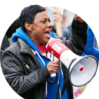 NEA President Becky Pringle speaks at Portland teachers' strike through a bullhorn