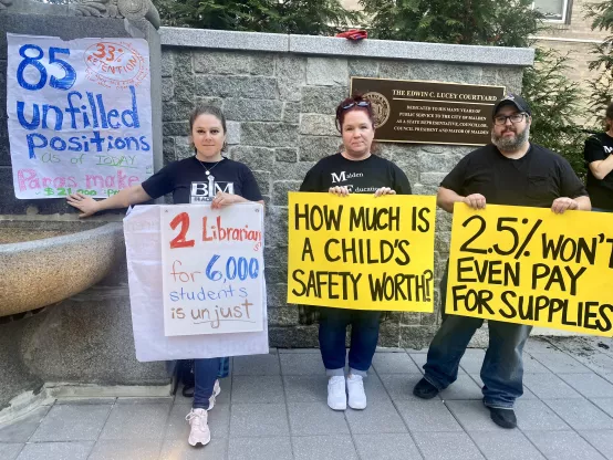 Malden union members with signs