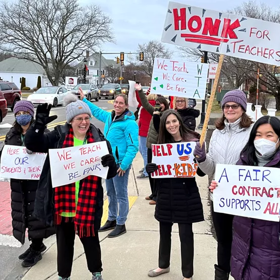 Members of the Woburn Teachers Association picketing