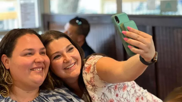 Members pose for a selfie.
