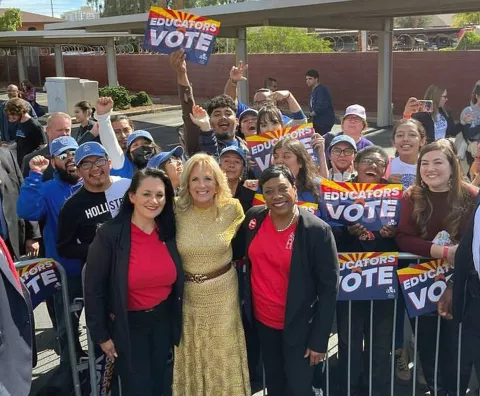 NEA President poses outside with First Lady Jill Biden and NEA members at a rally in Arizona